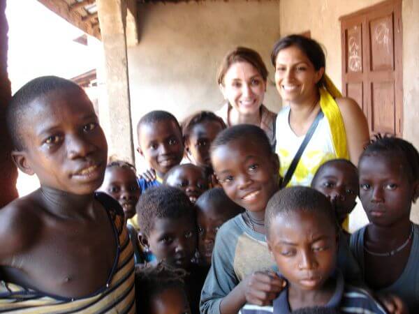 Terri and Niloufar with students at one of their first trips to Sierra Leone.