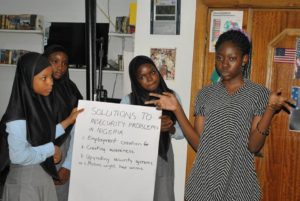A group of the girls present their solution to the security concerns in Nigeria at the STEM program organized by Mercy Sosanya, 2015 fellow, and Chioma Ezedi, 2016 Emerging Leader.